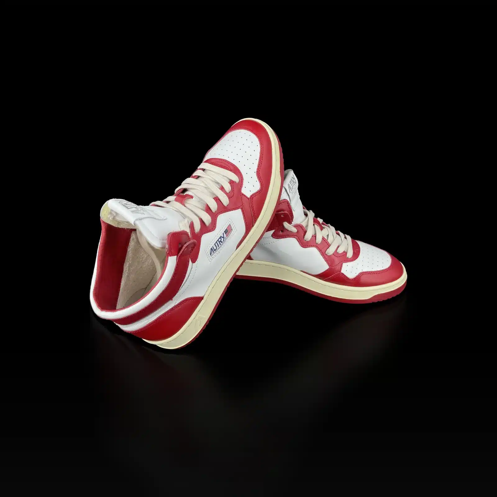 Pair of Autry Medalist Mid high-top sneakers in white and red, heel side view