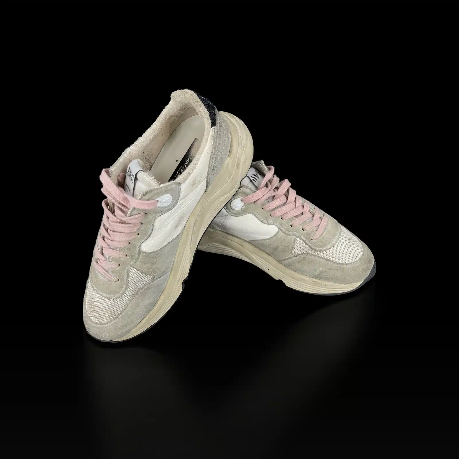 Pair of Golden Goose Running Sole sneakers, front view from the inner side