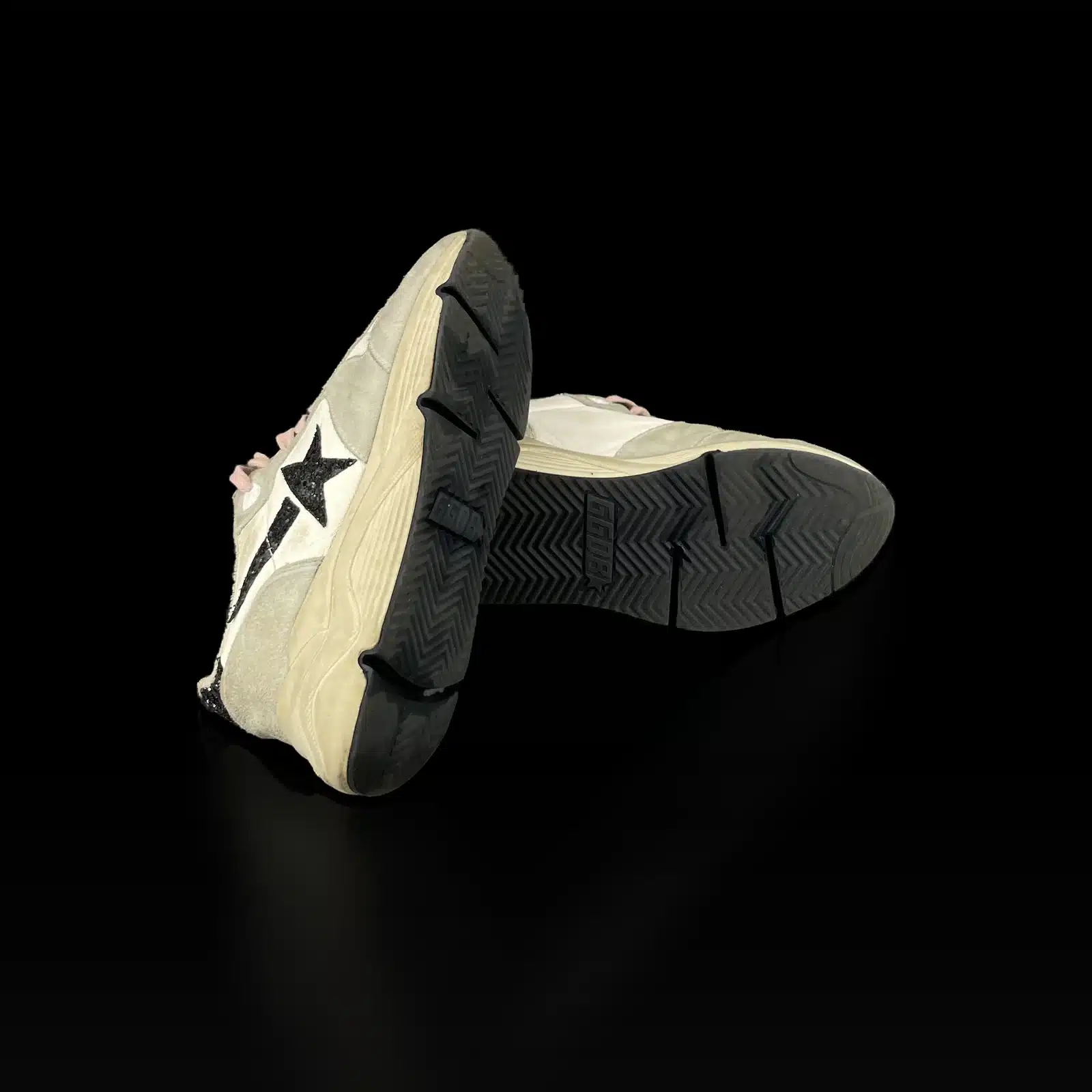 Black lug outsoles of Golden Goose Running Sole sneakers