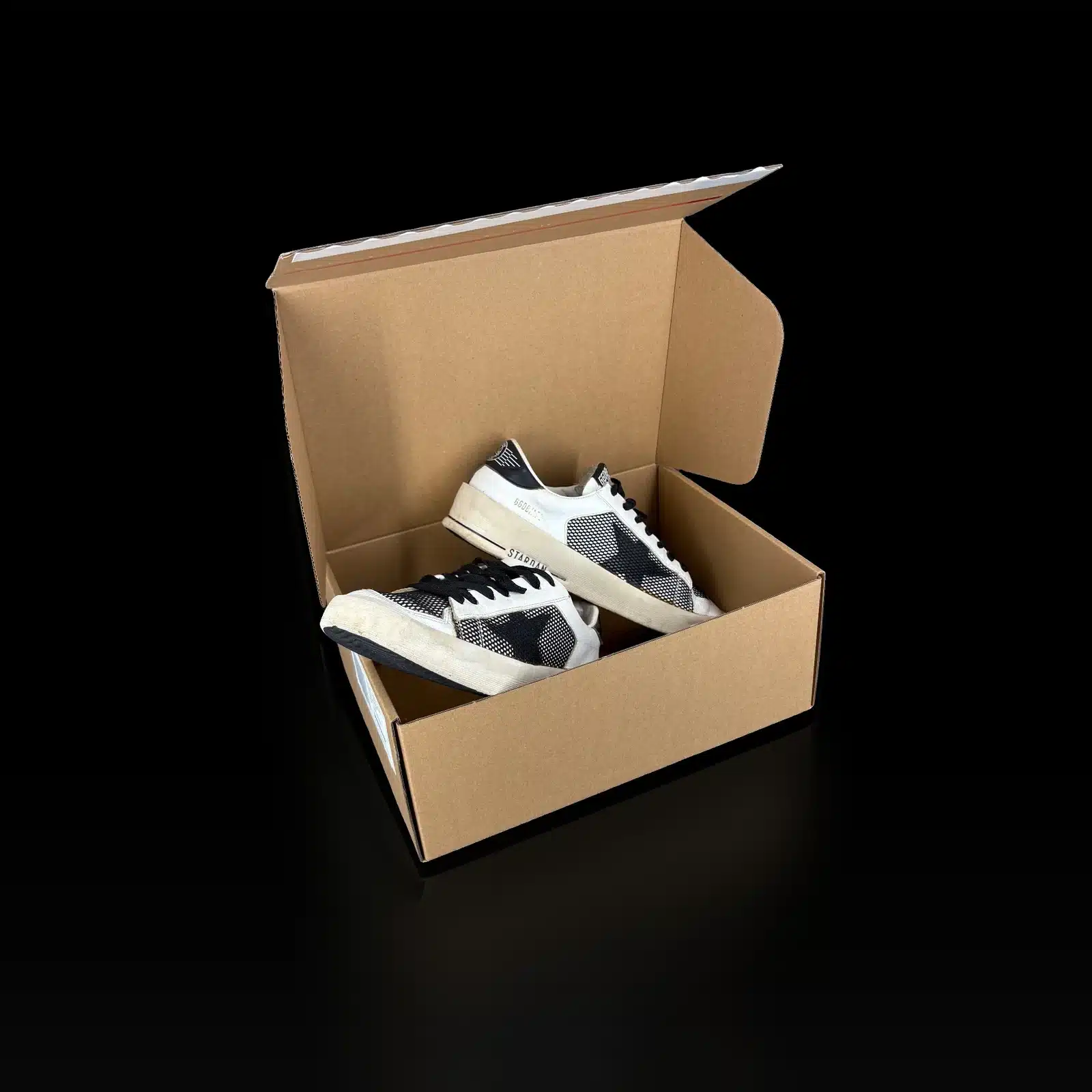 Paire de baskets Golden Goose Stardan, maille noire et languette GGDB, vue de face