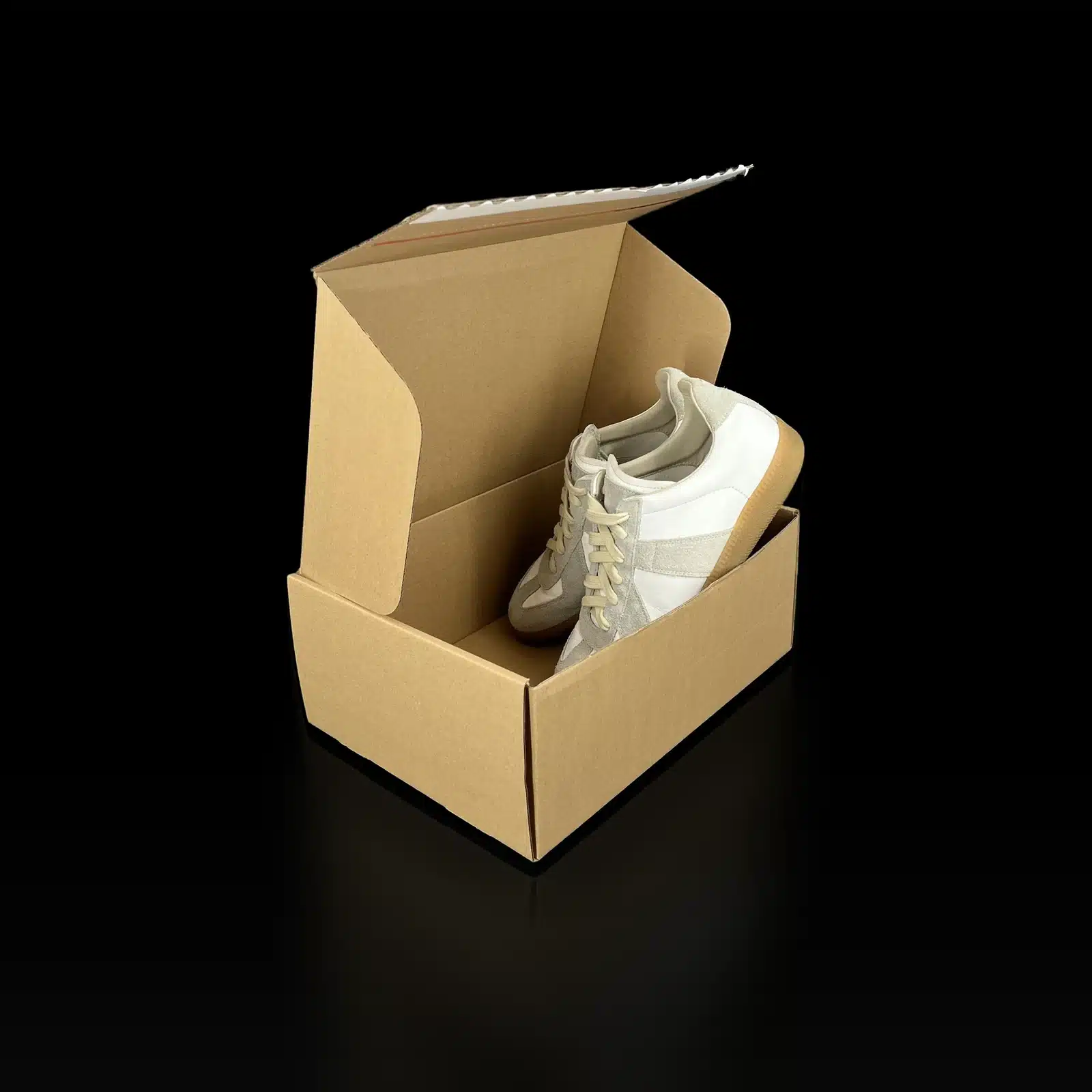 Baskets Maison Margiela Replica présentées dans leur boîte