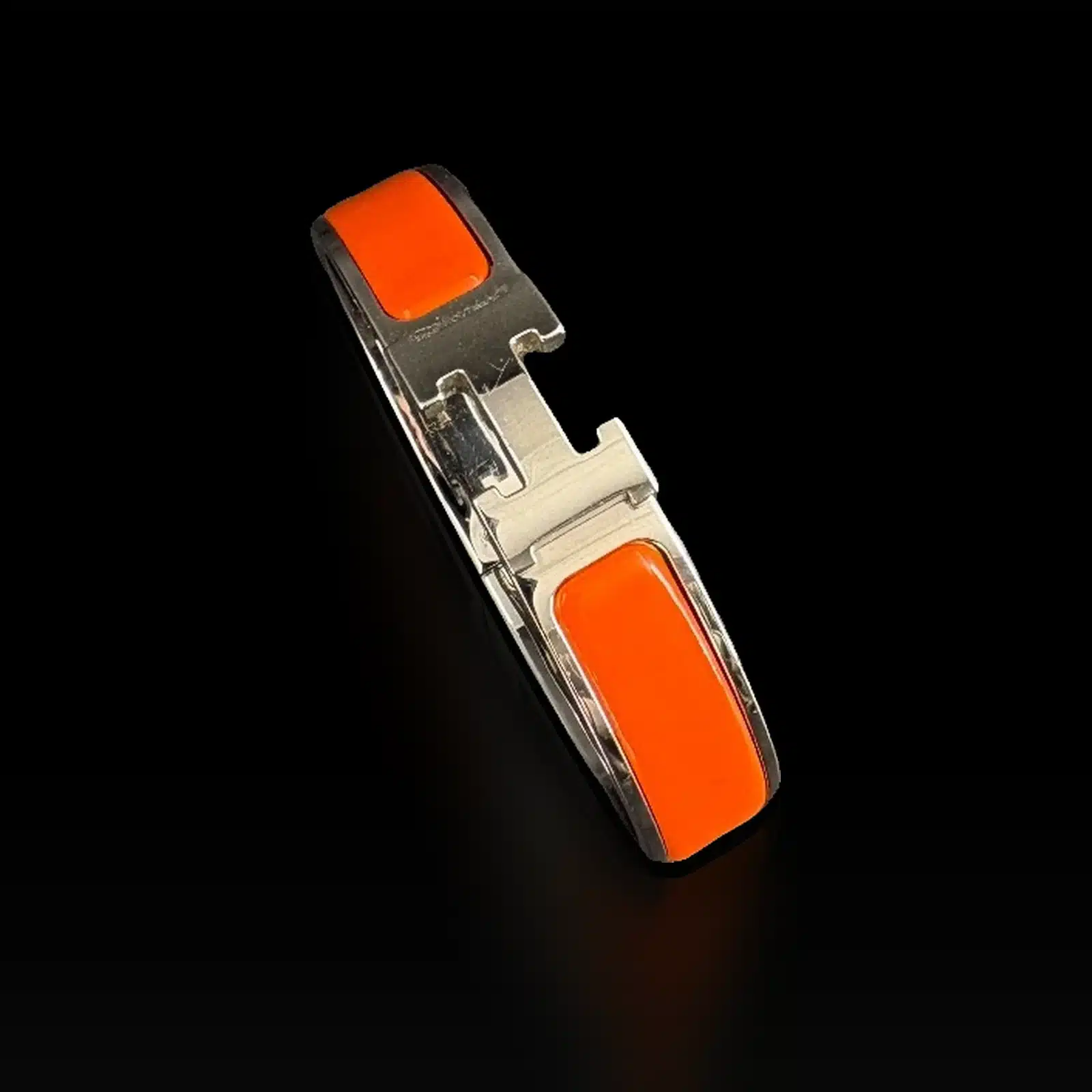 Bracelet Hermès Clic H orange vu de dessus, fermoir H palladié