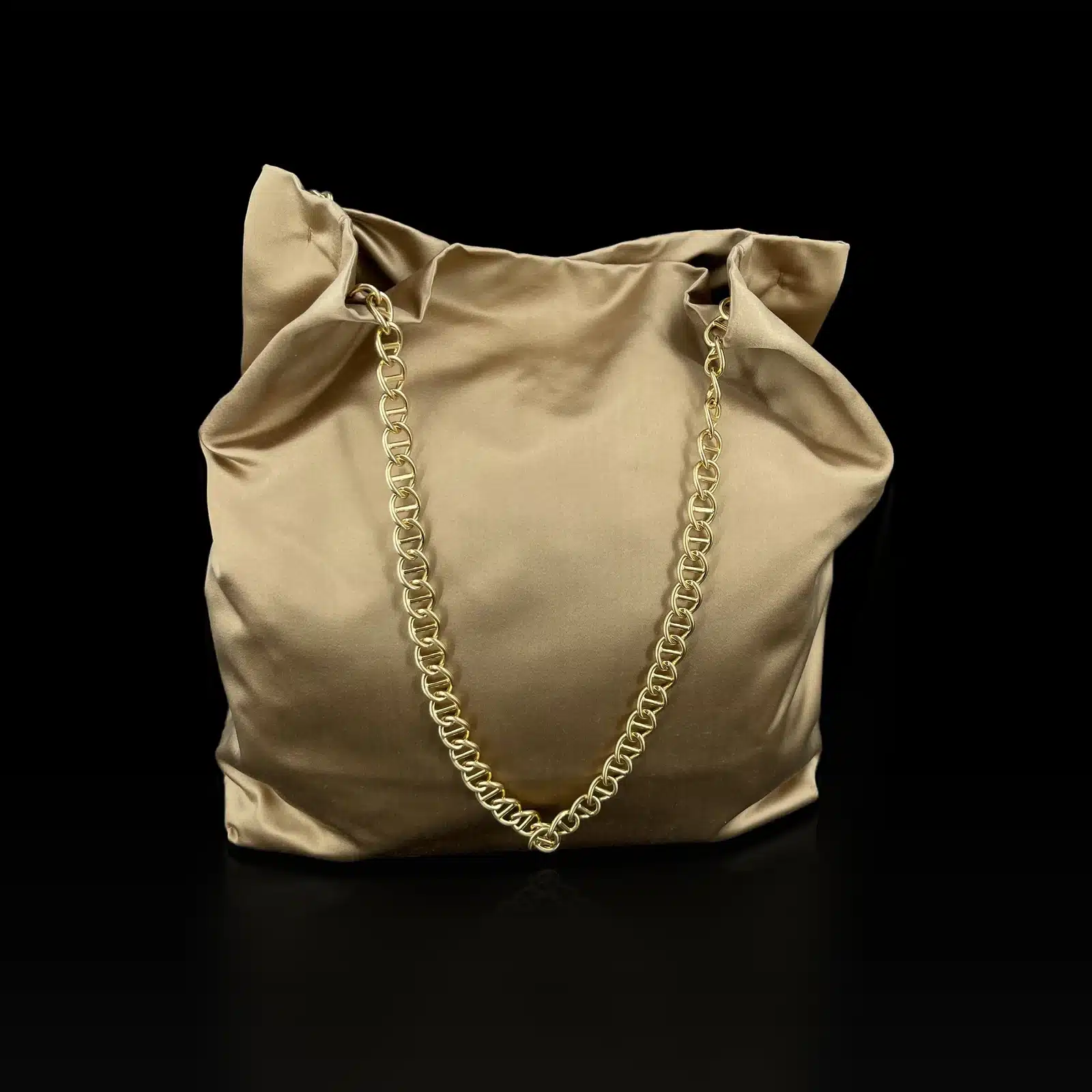 Prada gold satin tote, three-quarter view with Prada triangle plaque
