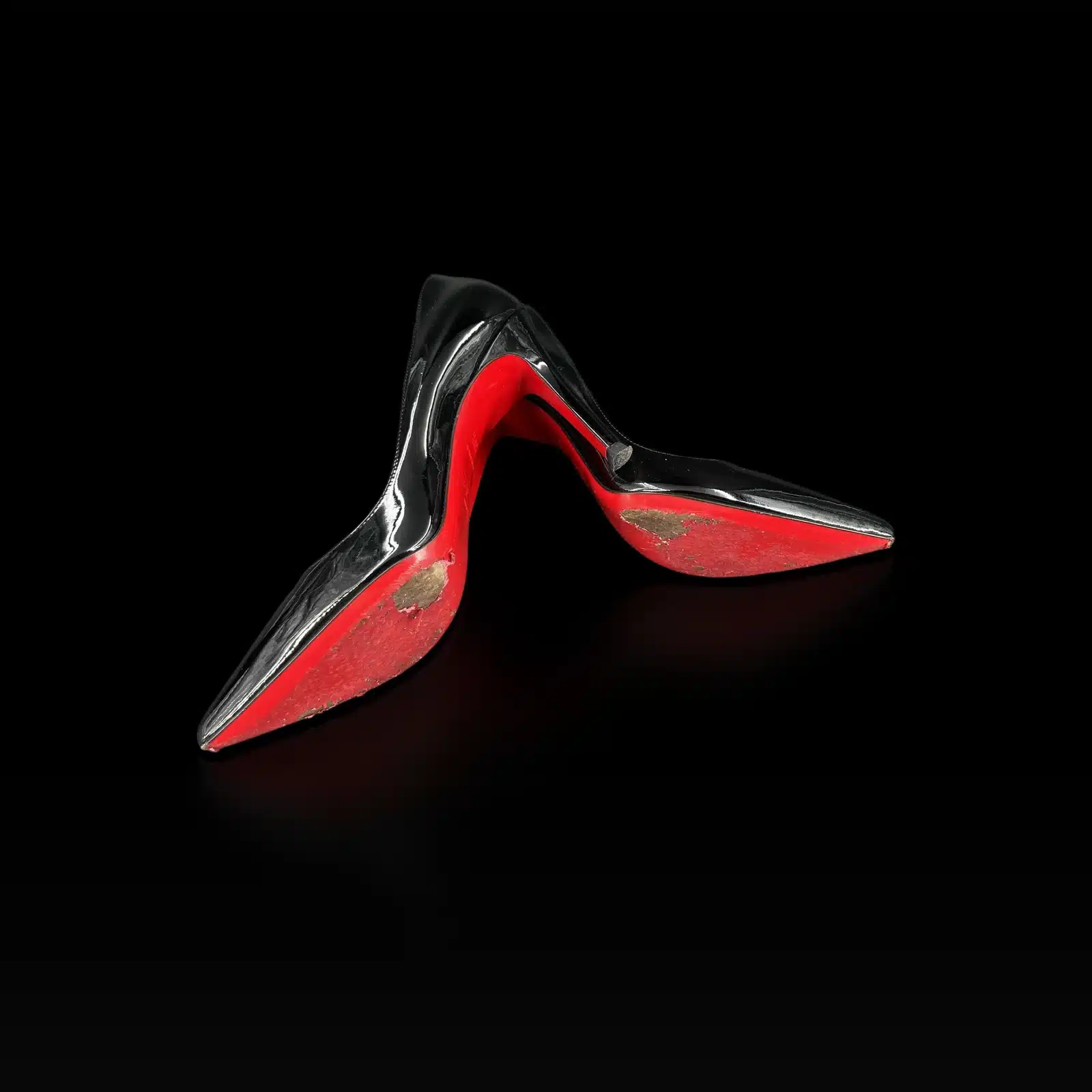 Semelles rouges des escarpins Christian Louboutin Pigalle 100 avec traces d'usure